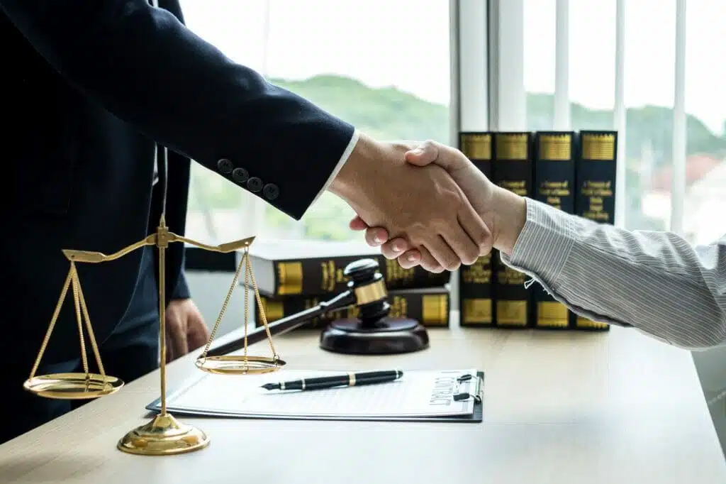 shake hand Professional man lawyers work at a law office There are scales, Scales of justice, judges